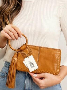 HOBO Metallic Gold Leather Wristlet with Tassel and Ring Handle